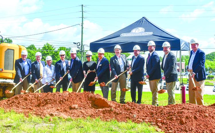 Rabun County Bank executives and local representatives gathered at a groundbreaking for the Clarkesville branch of Traditions Bank. Shown are (from left) Jerry Krivsky, Bob Tritt, Wanda Hutchison, Greg Funkhouser, Claude Dillard, Melanie Silvestri, Sidney Roland, Claude Rickman, Sam Beck, Victor Anderson, Bo Hatchett and Johnny Irvin. JULIANNE AKERS/Staff