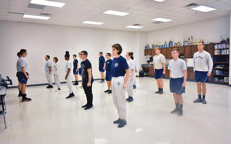 Students lead the class with stretch exercises to start off physical training, which the Air Force Junior Reserve Officer Training Corps at Habersham Central High School has every Friday.