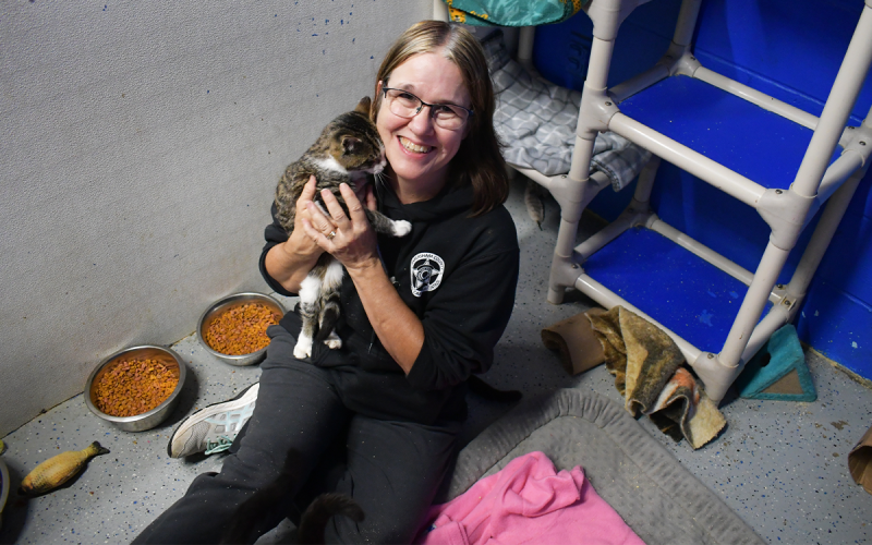 Jennifer Newcomb, a volunteer at Habersham County Animal Shelter, holds a new feline friend, Cassian. JOHN DILLS/Staff