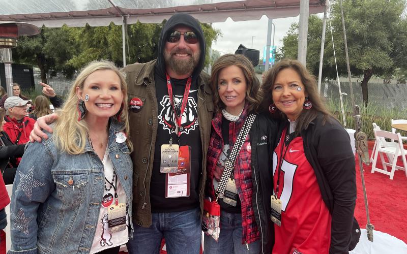 Clarkesville  attorney Tricia Hise (left) is shown with country singer Corey Smith and fellow Habersham Dawg fans Becky King and Allison Roland. TRICIA HISE/ Submitted