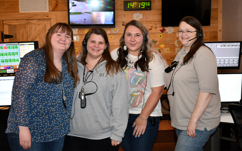 Habersham County 911 dispatchers Molly Willis, Tyger Whidden, Nadia Newsom and Belinda Konarski count on each other for support during the tough times. JOHN DILLS/Staff