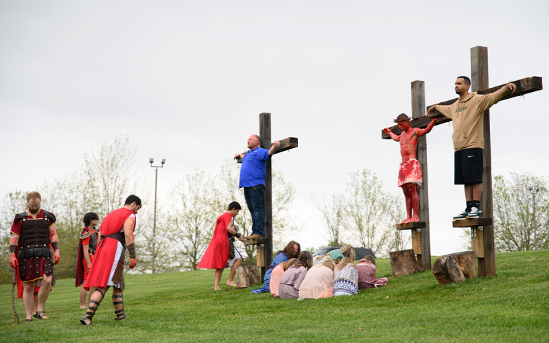The Torch’s three crosses occupied by Brandon Brock (left), Dalton Munroe (center), and Matthew Thomas (right) on Good Friday included Roman soldiers and a group of women praying with Mary at the foot of her son’s cross. ZACH TAYLOR/Special