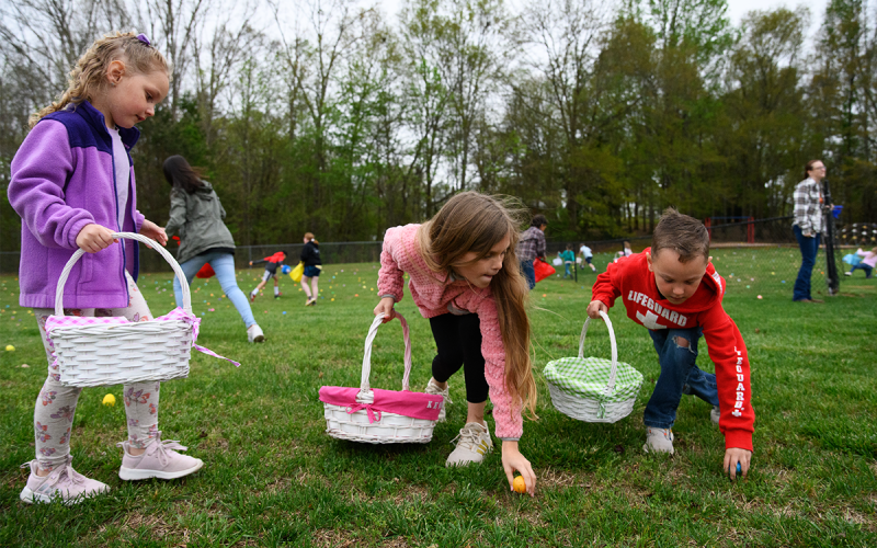 Addi Cobb, Kensley Wade and Collin Cobb (from left) lunge for Easter eggs on Friday at Bethlehem Baptist Church. ZACH TAYLOR/Special