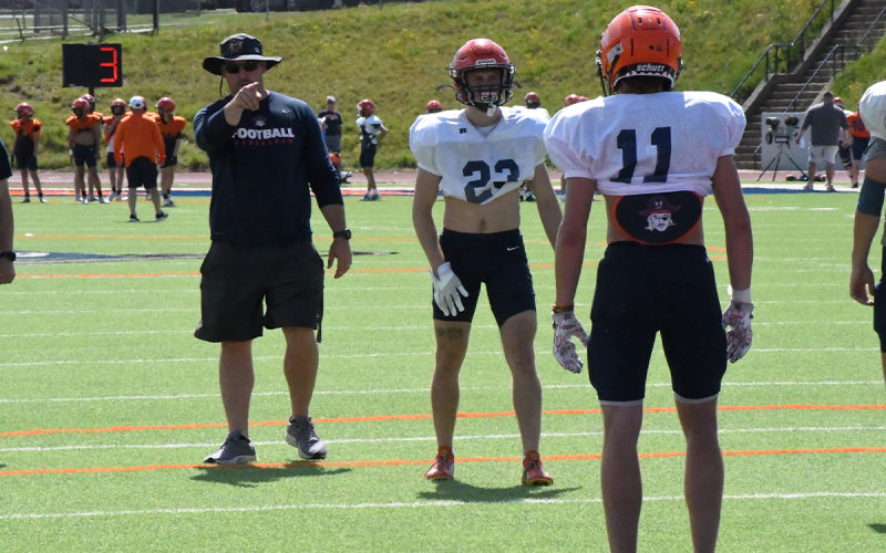 Habersham Central assistant coach Brandon Worley instructs players including Carter Barrett (23). LANG STOREY/Staff