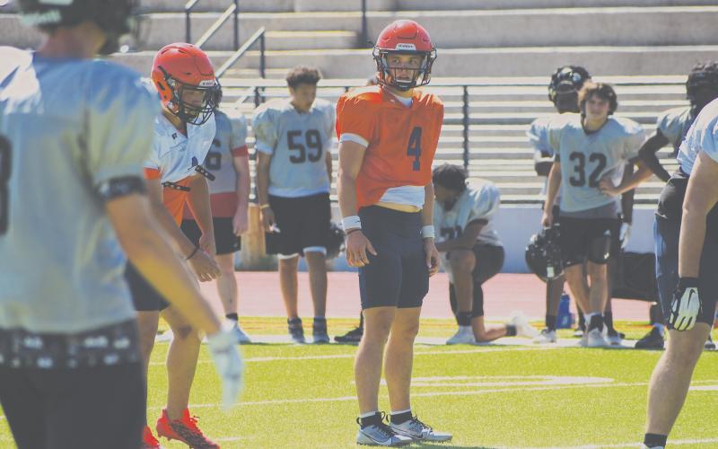 Habersham Central quarterback Carson Parker looks in for the signals during padded camp on Monday morning. LANG STOREY/Staff