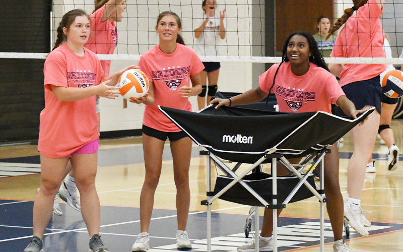 Current Habersham Varsity players (from left) Brooke Blackburn, Ava Saxon and Amayah Dooley have fun during a camp game. LANG STOREY/Staff