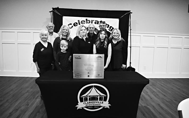 Clarkesville time capsule contributors included (back row, from left) Franklin Brown, Angelia Kiker, Brad Coppedge and Blake Rainwater. Front row are (from left) Mayor Barrie Aycock, Ben Kiker, Christy Sprinkle, Callie Cueva and Nora Almazan. SAMANTHA SINCLAIR/CNI News Service