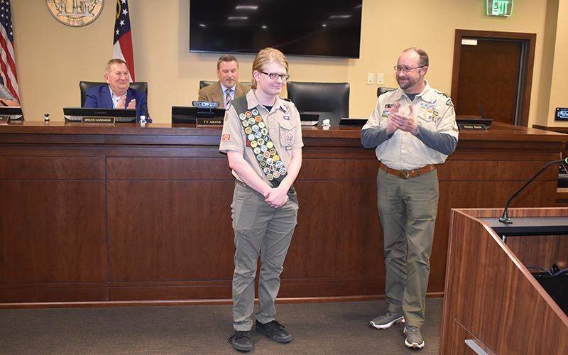 Jaren Campbell is recognized by the Habersham County Board of Commissioners on Monday night along with Scoutmaster Jake McGahee. JULIANNE AKERS/Staff