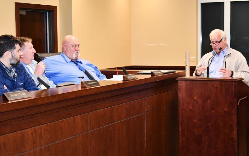 During a Habersham County Board of Commissioners meeting in 2021, Wade Rhodes shows off his admittedly crude model of placing PVC pipe underneath structures at the Airport Business Park to facilitate proper draining of water on the sites. MATTHEW OSBORNE/Staff