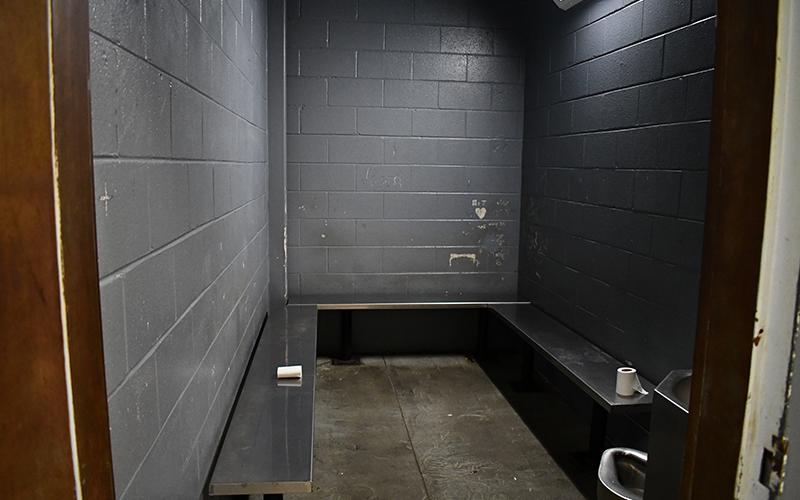 The holding cell where people who are arrested wait before being booked at the jail. JULIANNE AKERS/Staff