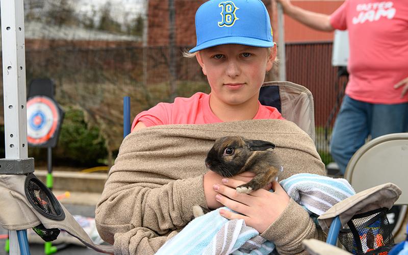 Nolan Carroll holds a pet bunny named Thrasher at the Easter Jam event in Cornelia.  ZACH TAYLOR/Special