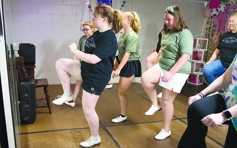 From left, Delaney Shirah leads clogging class in Cornelia with Emma  Grace McDuffie, Regan George and AnnaReese George. ZACH TAYLOR/Special