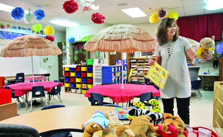 Demorest Elementary School kindergarten teacher Allison Roland decorates her classroom.
