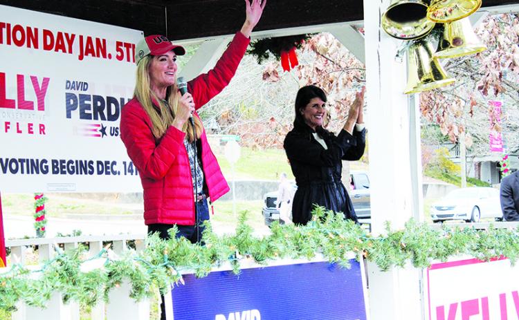 U.S. Sen. Kelly Loeffler waves acknowledges applause from a crowd of 250-plus on the second stop of her statewide firewall tour Sunday in Demorest. Loeffler was joined by former U.N. Ambassador Nikki Haley (right) for each of her stops throughout the day.