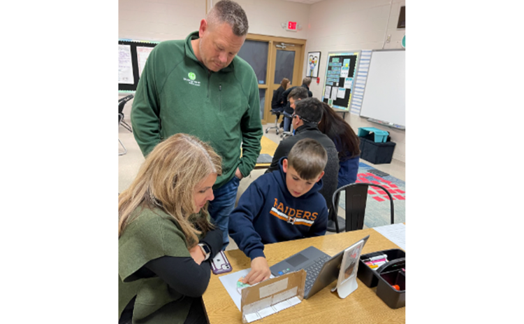 Mason Gallman, a student in Mrs. Esparza’s class at Clarkesville Elementary, helped his parents determine the meaning of words and phrases as they are used in a text, such as metaphors and similes. SUSAN DAVIS/Submitted