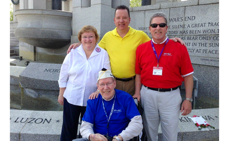 Kenneth Schubring Sr., seated, is shown with his children, Betsy Schubring Crossley of Brentwood, Tennessee, William Schubring of Commerce and Kenneth Schubring Jr. of Clarkesville during an Honor Flight tour of the World War II Memorial in Washington, D.C. in 2015. SUBMITTED