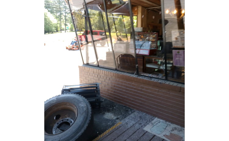 The front window of Cowboy Bob’s was broken by a stray truck tire from an accident Monday afternoon. PAULA KUBINCHAK/Submitted