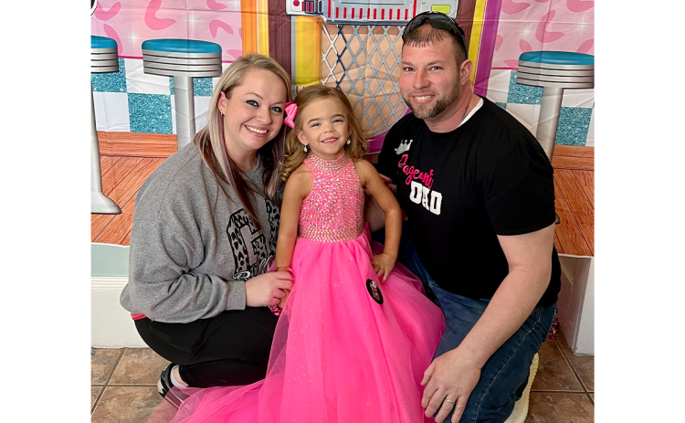 Marlee-Kate Lee of Clarkesville (center) with her mom Laura and dad Paul. LAURA LEE/Submitted