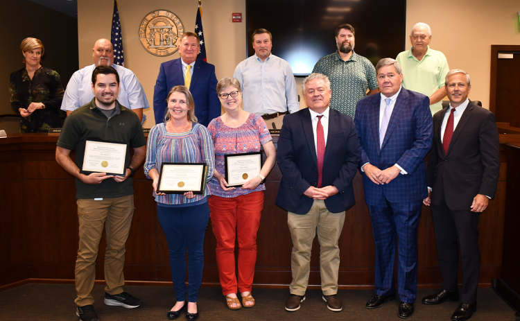 Shown are (front row, from left) Alex Wimberly, IT Specialist II; Tracy Williamson, IT Director; Diana Gallegos, IT Administrator; and Superior Court Judges Rusty Smith, Bill Oliver and Chan Caudell. Back row are (from left) County Manager Alicia Vaughn and Commissioners Bruce Palmer, Bruce Harkness, Ty Akins, Dustin Mealor and Jimmy Tench. Alvin Stinnett, IT Specialist,  also was recognized. MATTHEW OSBORNE/Staff