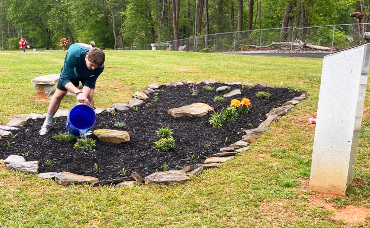 Christian Cooper worked his way through his Eagle Scout project on April 29. The project he chose was to make a flower bed at the VFW Memorial Park. SUBMITTED