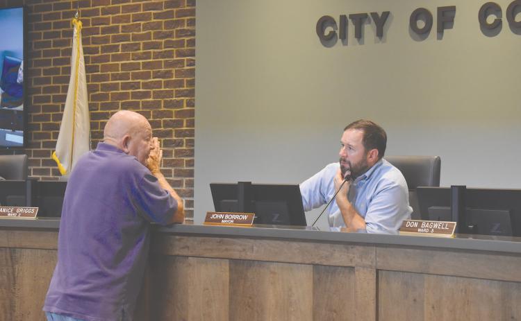 Longtime Cornelia citizen Ray Barrett shared his concerns with Mayor John Borrow (right) and the city commissioners on various issues.