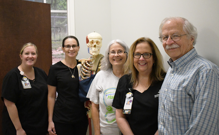Dr. William McLean (right) has been serving Habersham County in orthopedics for 40 years. Left to right are the staff of Habersham Medical Center’s Ostomology group Miranda Scott, Tanya Presley, Dr. Bones, Judy Parker and Michelle Edwards. JOHN DILLS/Staff