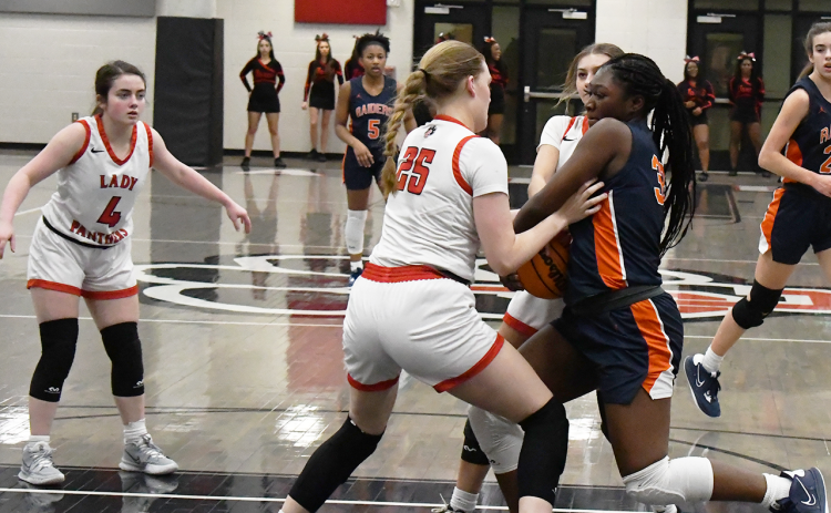 Habersham Central’s Sataria Cantrell battles in the lane against Gainesville High during her senior season. FILE