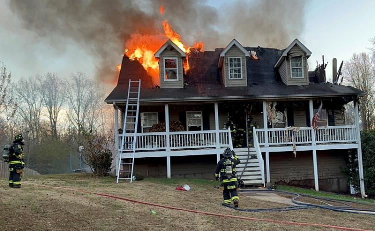 Firefighters work to contain a blaze at a Baldwin home Monday. HABERSHAM COUNTY/Submitted
