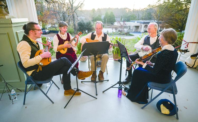 The Elderberries, comprised of Michael Daves, Elizabeth Crittenden, Larry King, Walter Daves and Jeanie Daves, provide entertainment for the Founders Ball celebrating Clarkesville’s Bicentennial year.