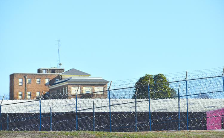 Lee Arrendale State Prison had a large contingent of law enforecement vehicles come in, but a spokseman denied they were moving the inmates out. MATTHEW OSBORNE/Staff