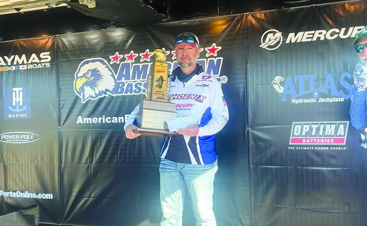 Brad Benfield holds his trophy after winning the 2024 American Bass Anglers (ABA) Ray Scott Championship title. SUBMITTED