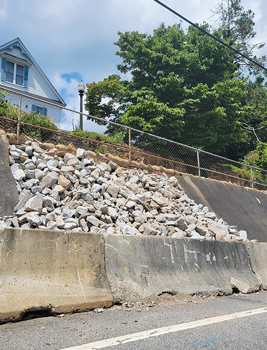 Until its repairs are more complete, the wall on Central Avenue in Demorest is little more than a pile of rocks in part where the outer surface has given way to the eroded emptiness below. The Department of Transportation is scheduled to make the final repairs sometime over the next 6-9 months. ALAN NESMITH/Staff