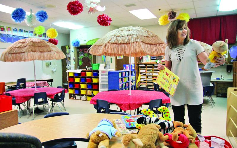 Demorest Elementary School kindergarten teacher Allison Roland decorates her classroom.