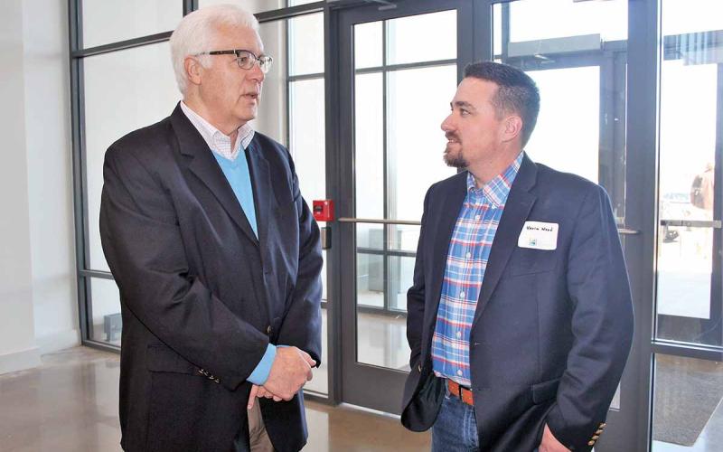 Habersham Partnership for Growth/Economic Development Council Executive Director Tim Lee, left, chats with Kevin Wood, owner of Wood’s Mercantile in Clarkesville, earlier this year on the Clarkesville campus of North Georgia Technical College. Lee died Sunday at the age of 62 from complications due to cancer. (Photo/HABERSHAM CHAMBER OF COMMERCE)