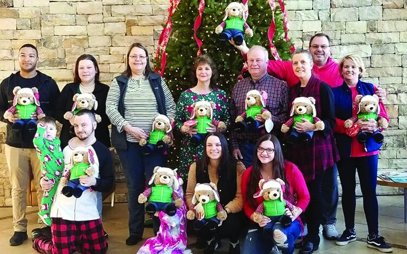 Habersham County Farm Bureau handed out Belkie Bears to patients at Habersham Medical Center as part of their Beary Merry Christmas on Wednesday morning. Participants are, back row from left, Malik Perry, Katie Peck, Julie Owens, Janet Wilbanks, Jimmy Kowalsky, Habersham County Farm Bureau president; Cheryl Kowalsky, Habersham County Women’s Committee; Tim Bryant, agency manager; and Chris Bryant. Front row are, from left, Joseph Peck with Noah, Raven Peck, Brette Bryant and Lauryn Bryant.