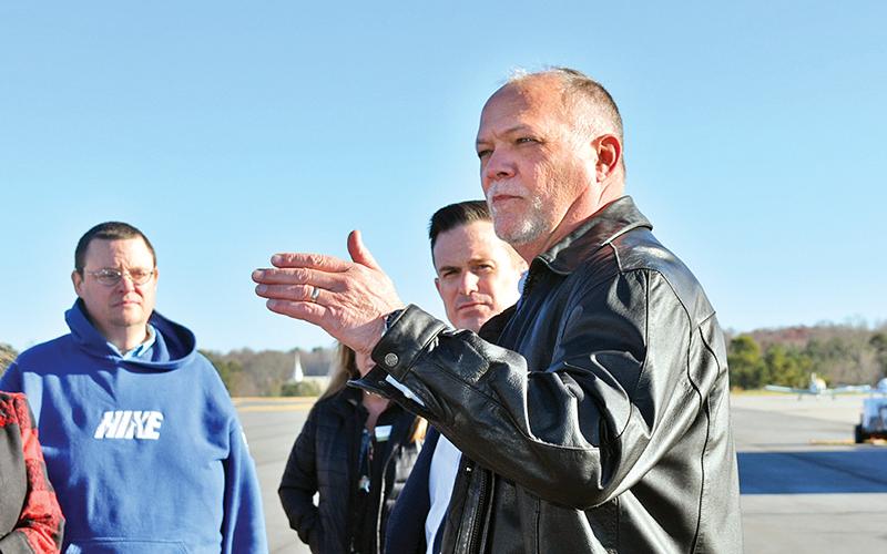Joe Pardue, Air Methods area manager, talks to the assembled guests during the AirLife ribbon cutting on Wednesday morning.