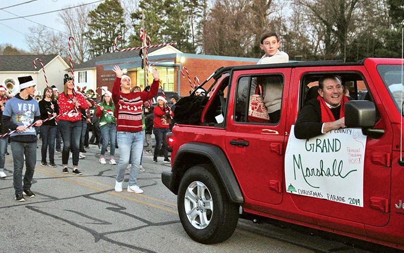 The Habersham County Christmas Parade made its way through Baldwin on Saturday night, with grand marshal Habersham Central Principal Jonathan Stribling leading the way for the Band of Blue from his own school.