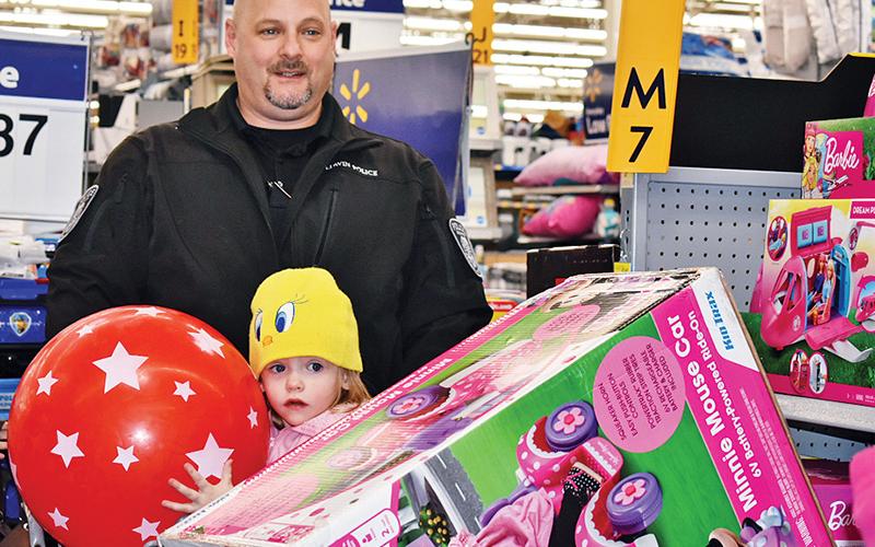 Though small, 3-year-old Lilith Chambers took the opportunity get some big gifts Thursday morning with Lt. Shuk Hamdan of the Baldwin Police Department. The shopping spree was due to Baldwin's annual Shop With a Hero, where 15 total children this year had a budget of $300 to get whatever they wanted.
