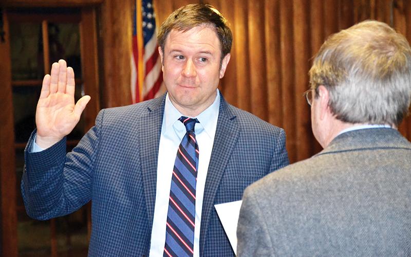 New Cornelia Mayor John Borrow is sworn in Tuesday night before the commission meeting.