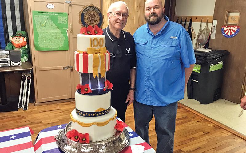 At Tuesday’s American Legion 100th year celebration, the oldest and youngest veterans present took a moment for a picture with the cake. Van Wunderlich, 94, of Demorest served in World War II, while Corp. Michael Dale, 39, of Cornelia served in Afghanistan.