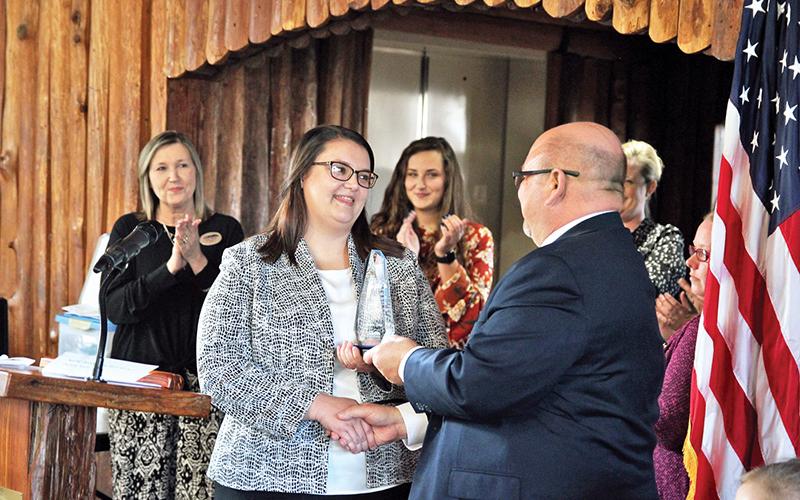 North Georgia Tech College President Dr. Mark Ivester hands the GOAL award to Dietra Gray.