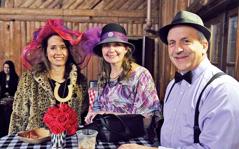 Kecia Jones of Demorest and Greg and Laura Lee Burrell of Cornelia pose for a photo at Saturday’s “Night at the Derby.”
