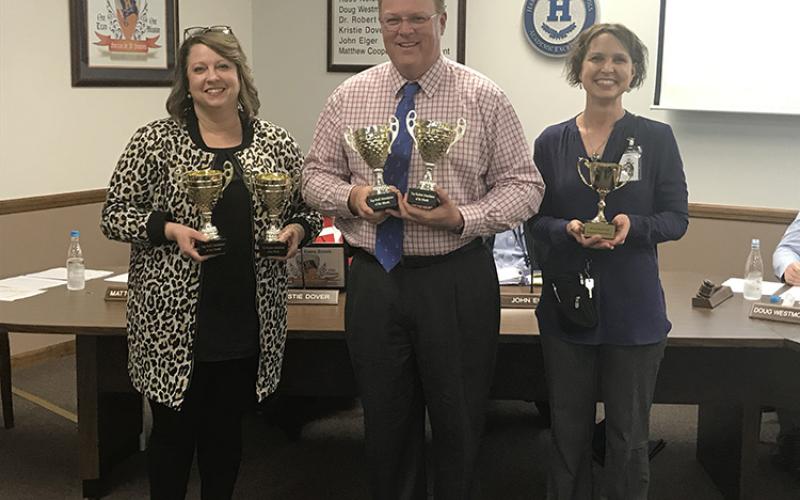 Attendance winners for January were honored at Monday’s Habersham County Board of Education meeting, including double winners for student and faculty attendance Habersham Ninth Grade Academy, represented by Principal Connie Franklin (left), and Baldwin Elementary, represented by Principal Rodney Long. The most improved attendance award went to Woodville Elementary, represented by Susan Davis (right).