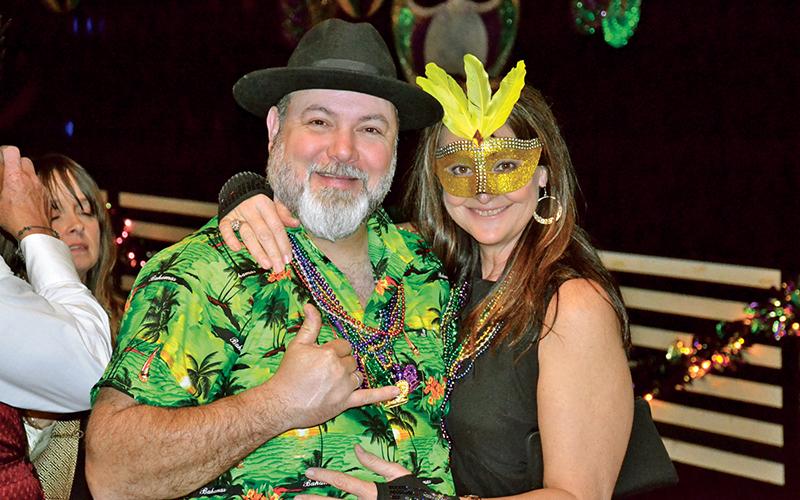 Hawaii meets New Orleans as this happy couple partied at the Clarkesville Mardi Gras event.