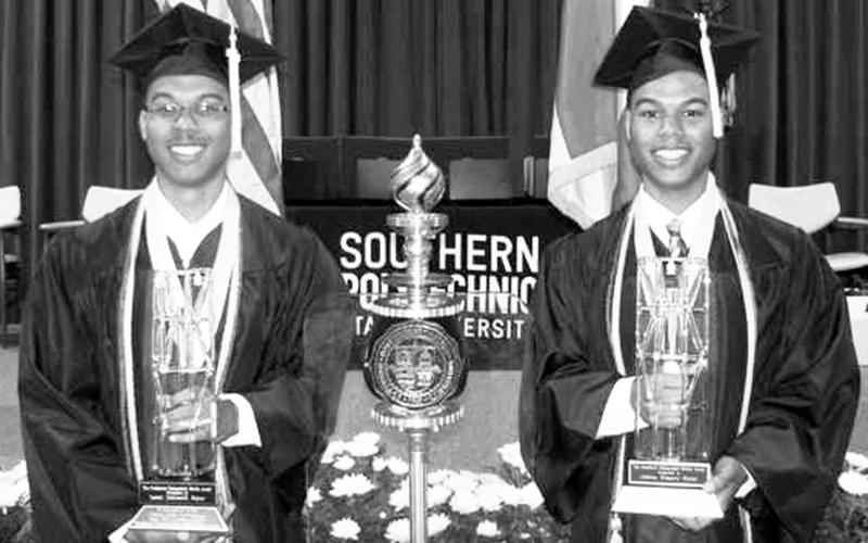 Dr. Joshua Gober and Dr. Isaiah Gober display their honors.