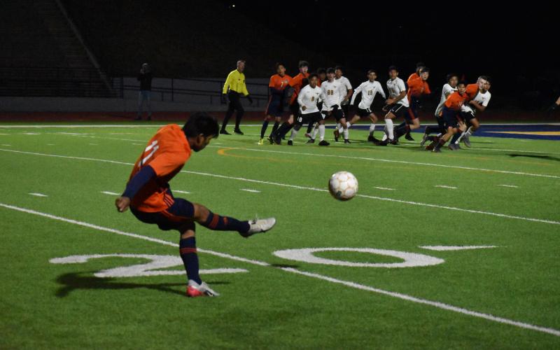Habersham Central's Yobani Alvarez sends a free kick into the box during the Raiders' 2-1 loss to Lanier High School Friday.