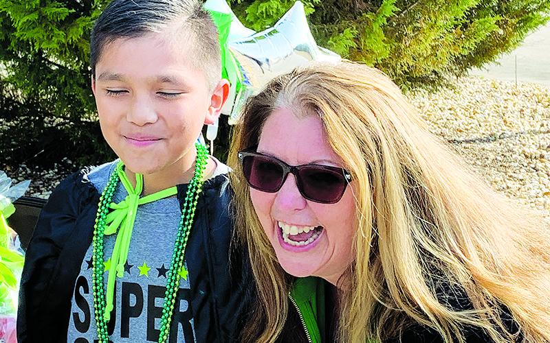 Level Grove Elementary School Principal Dr. Darlene Hudson stands with fourth grader Junior Gutierrez at his cancer-free diagnosis celebration.