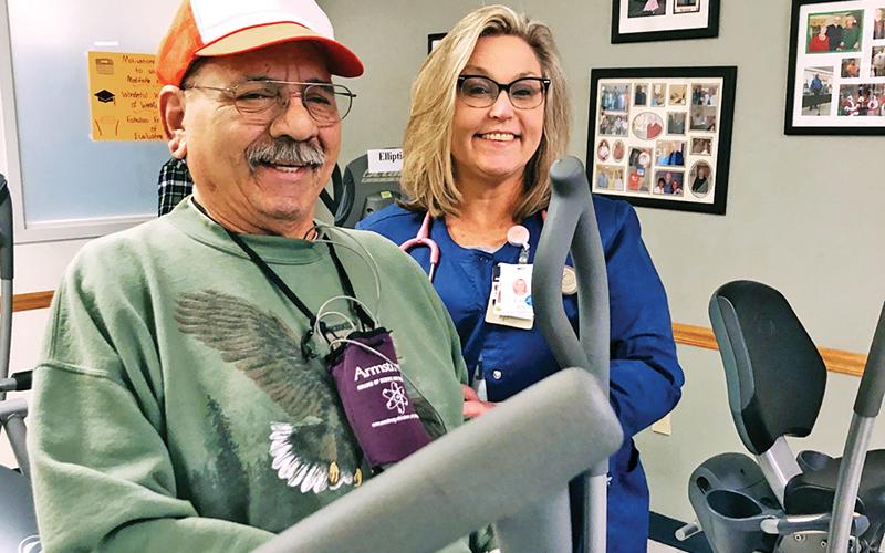 Lisa Reiss, Program coordinator for HMC’s cardiac and pulmonary rehab program, works with patient Jesse Garcia.