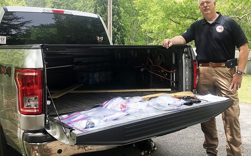 Habersham County Sheriff Joey Terrell shows off some of the seized drugs from a raid in Alto on Wednesday.