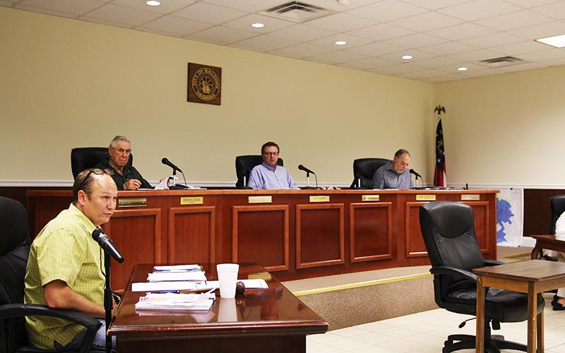 Baldwin Mayor Joe Elam speaks during the Monday city council meeting. Behind him are Councilmen Theron Ayers, Jeff Parrish and Larry Lewallen.
